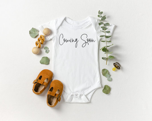 Coming Soon Cursive Script Onesie