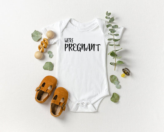 We're Pregnant Simple Baby Onesie